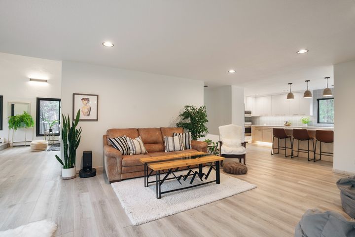 Open living room flowing into the renovated kitchen